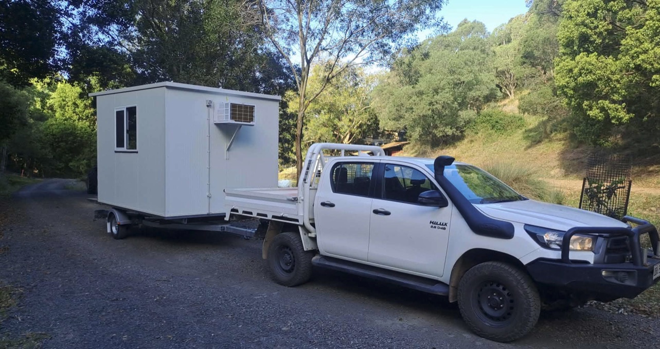 An Easy Portable Hire room being transported on its purpose-built trailer